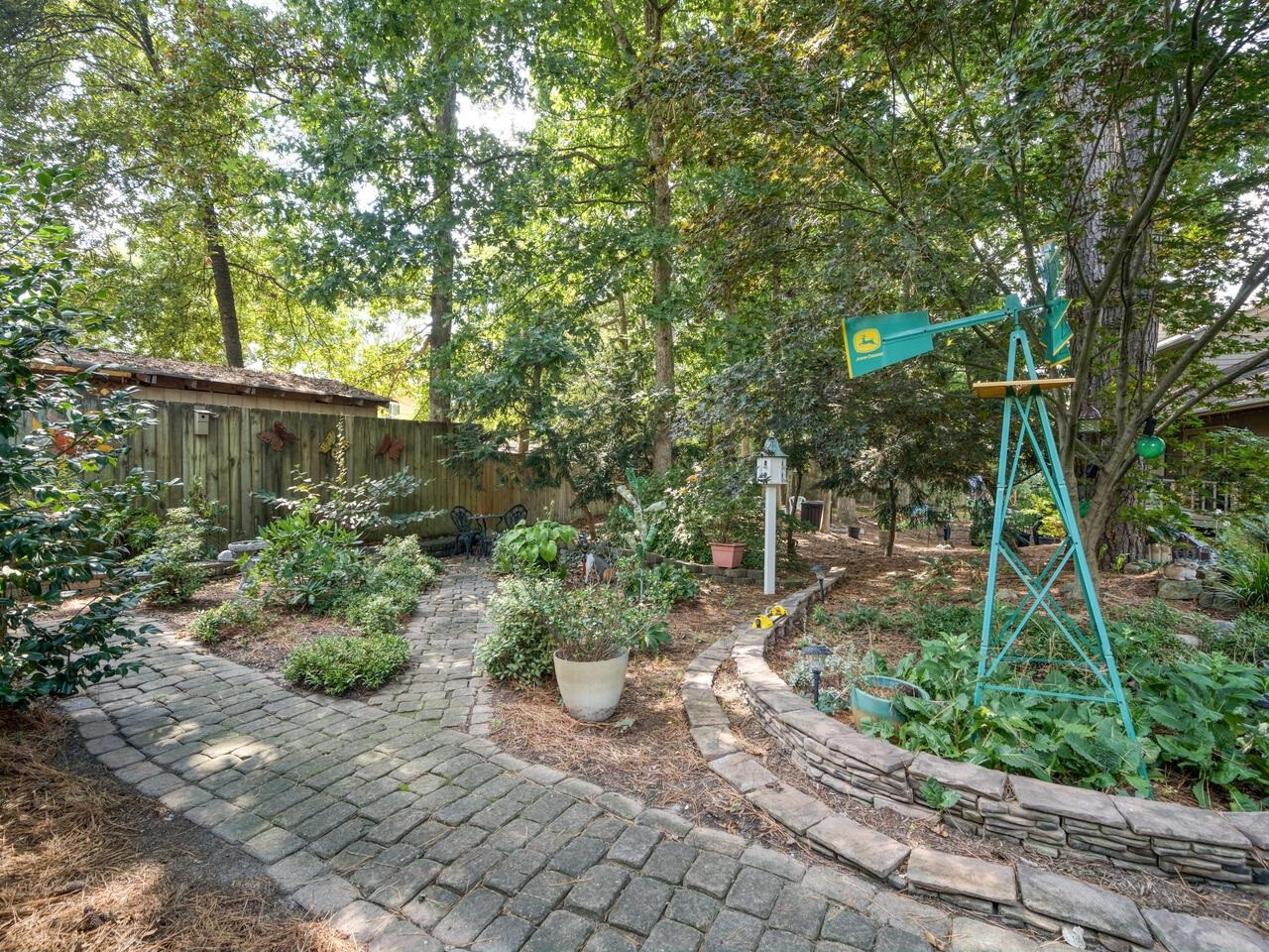 2603 Sawmill Road Raleigh, NC 27613 - Photo 51 of 53 a backyard of a house with lots of green space and plants