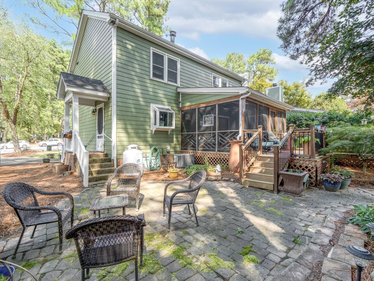 2603 Sawmill Road Raleigh, NC 27613 - Photo 53 of 53 a view of a patio with table and chairs and potted plants