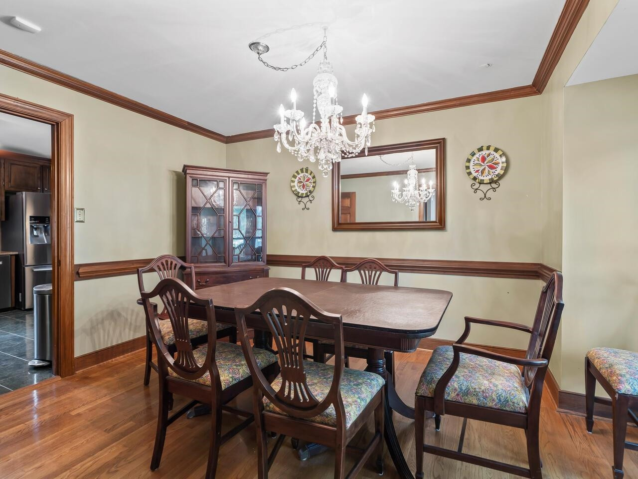 2603 Sawmill Road Raleigh, NC 27613 - Photo 8 of 53 a view of a dining room with furniture and chandelier