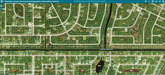 a view of a building with a big yard and plants