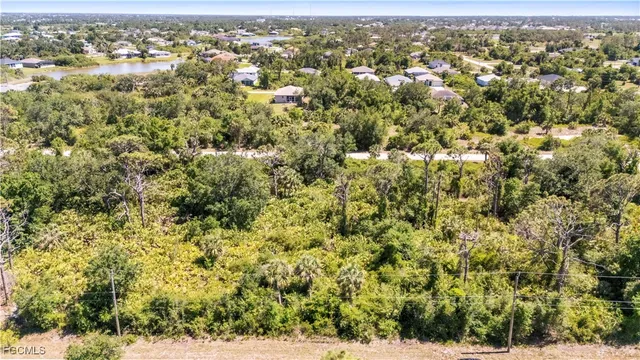 an aerial view of houses with yard