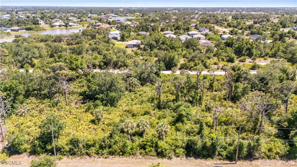7577 Coach Road Port Charlotte, FL 33981 - Photo 4 of 5 an aerial view of houses with yard