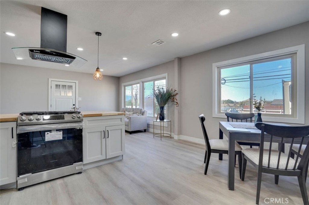 4141 California Norco, CA 92860 - Photo 12 of 28 a kitchen with stainless steel appliances granite countertop a stove a sink and a refrigerator