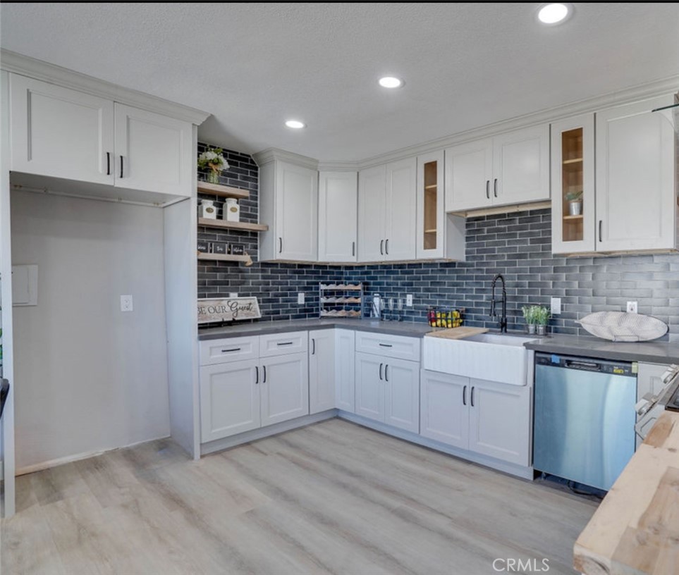 4141 California Norco, CA 92860 - Photo 14 of 28 a kitchen with stainless steel appliances white cabinets and a sink