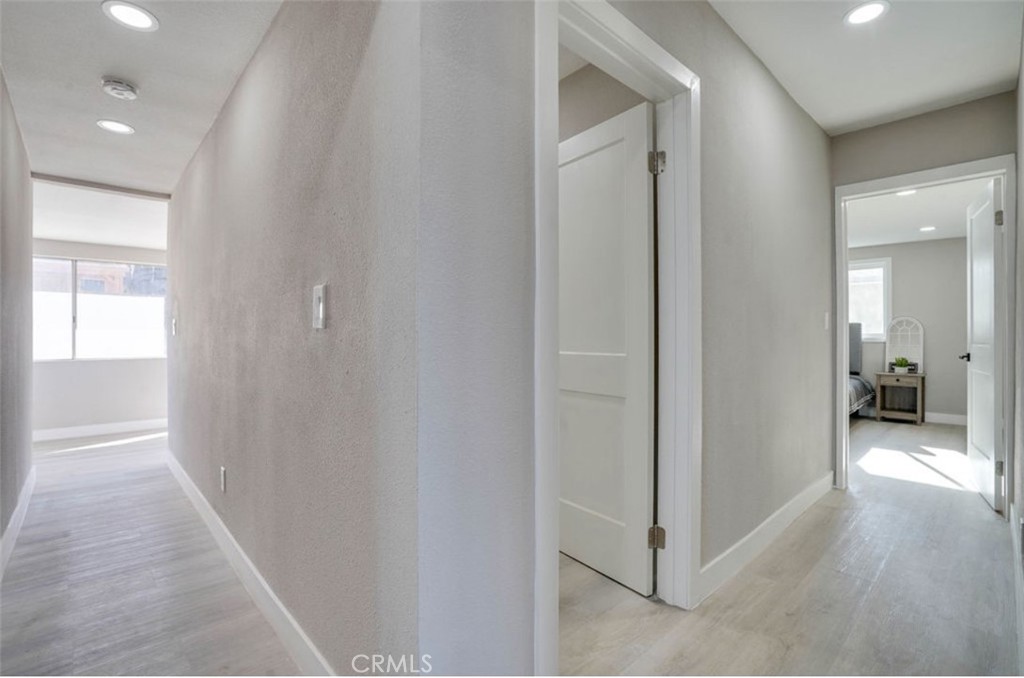 4141 California Norco, CA 92860 - Photo 20 of 28 a view of a hallway with wooden floor and a bathroom