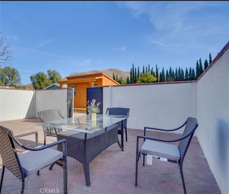 4141 California Norco, CA 92860 - Photo 25 of 28 a patio with a table and chairs
