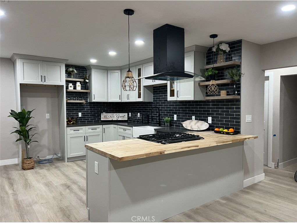 4141 California Norco, CA 92860 - Photo 9 of 28 a kitchen with stainless steel appliances granite countertop a sink a stove and a refrigerator