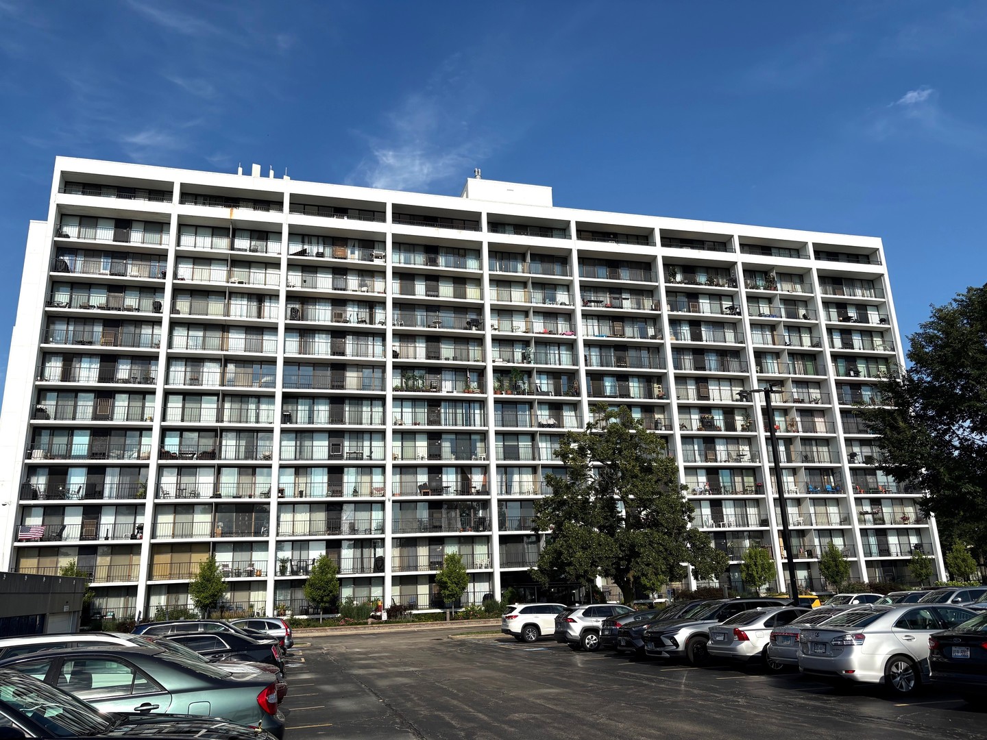 a view of a street with a cars parked in front of it