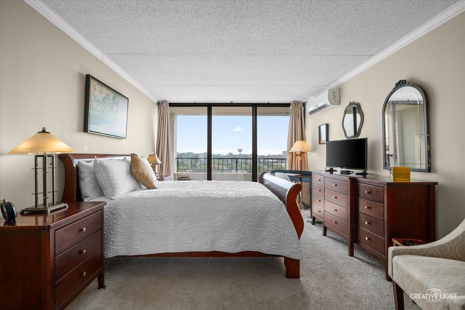 2005 South Finley Road, Unit 1209 Lombard, IL 60148 - Photo 11 of 29 a bed room with a bed and a television