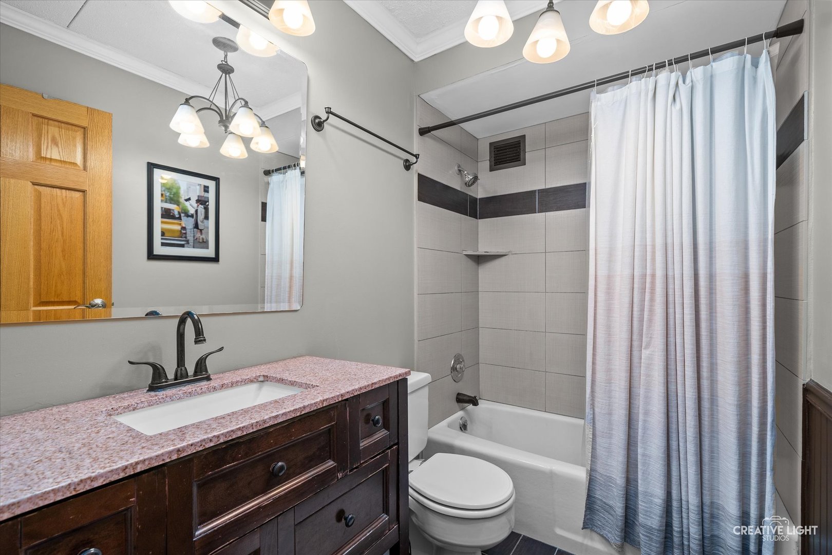 2005 South Finley Road, Unit 1209 Lombard, IL 60148 - Photo 13 of 29 a bathroom with a granite countertop sink a toilet a mirror a vanity and shower