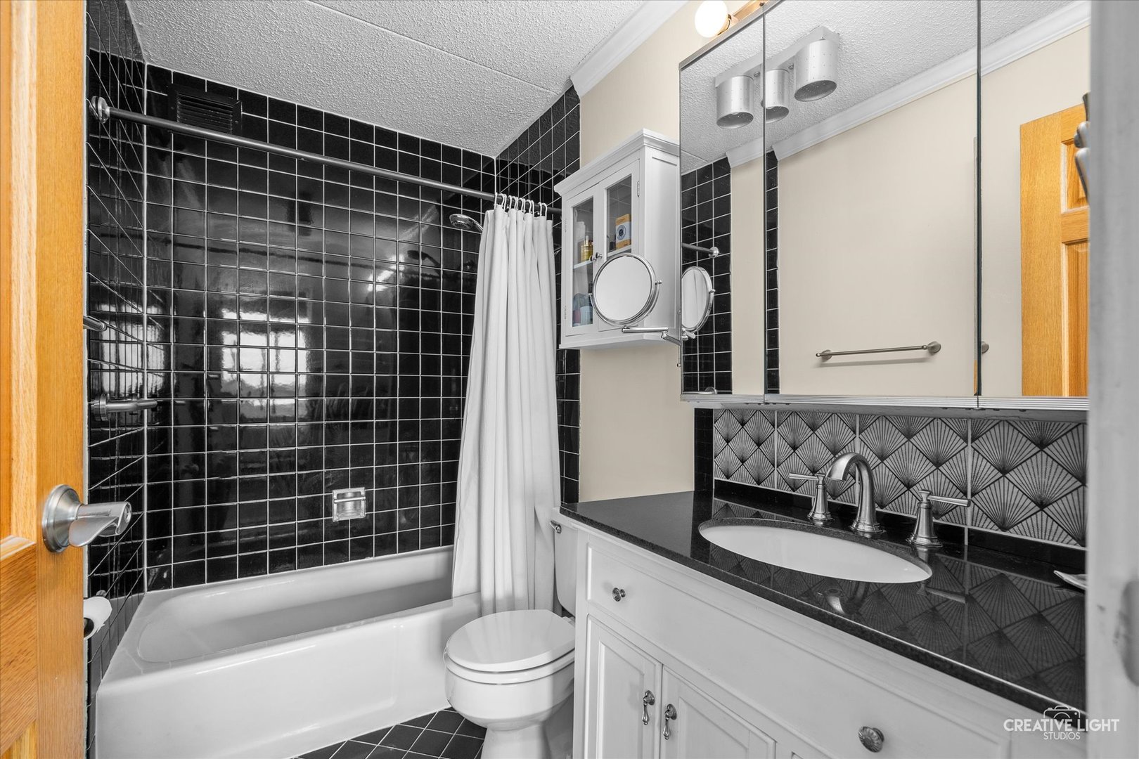 2005 South Finley Road, Unit 1209 Lombard, IL 60148 - Photo 14 of 29 a bathroom with a granite countertop sink toilet and shower