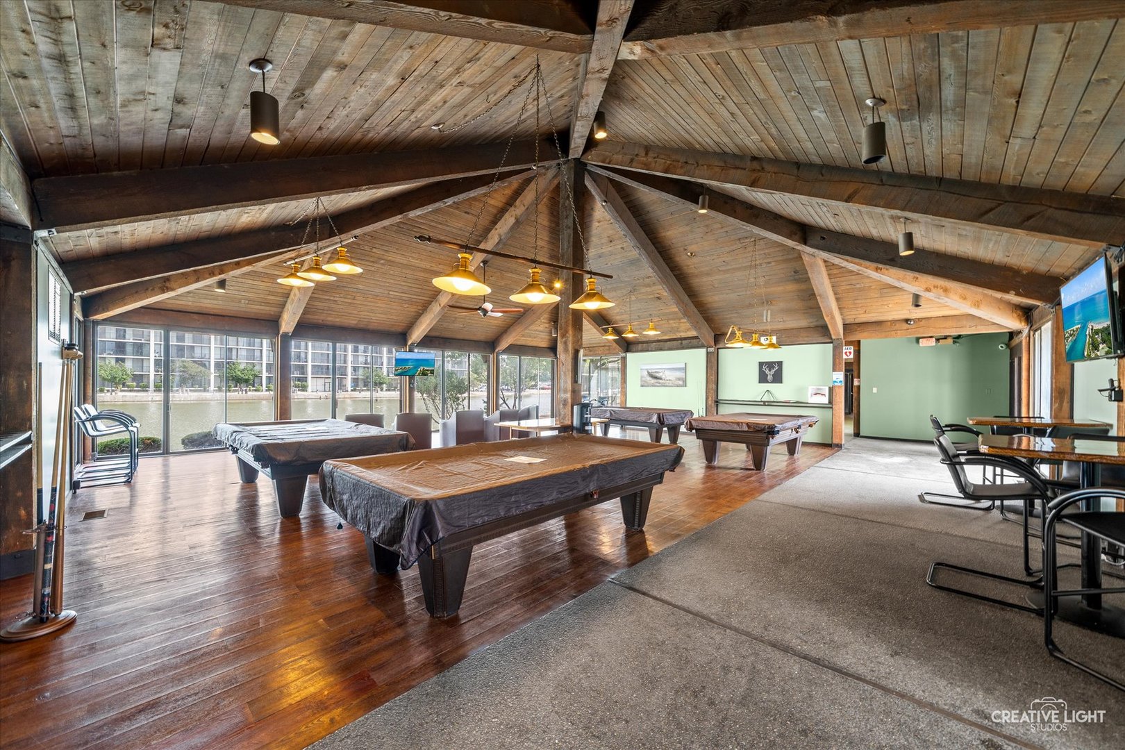 2005 South Finley Road, Unit 1209 Lombard, IL 60148 - Photo 19 of 29 a view of a patio with table and chairs under an umbrella