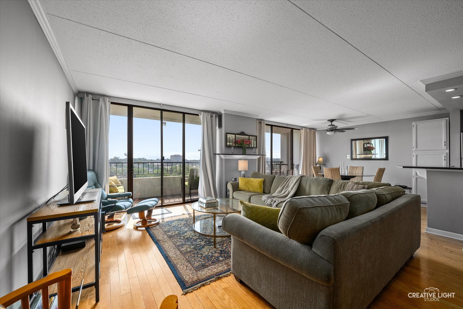 2005 South Finley Road, Unit 1209 Lombard, IL 60148 - Photo 2 of 29 a living room with furniture and a flat screen tv