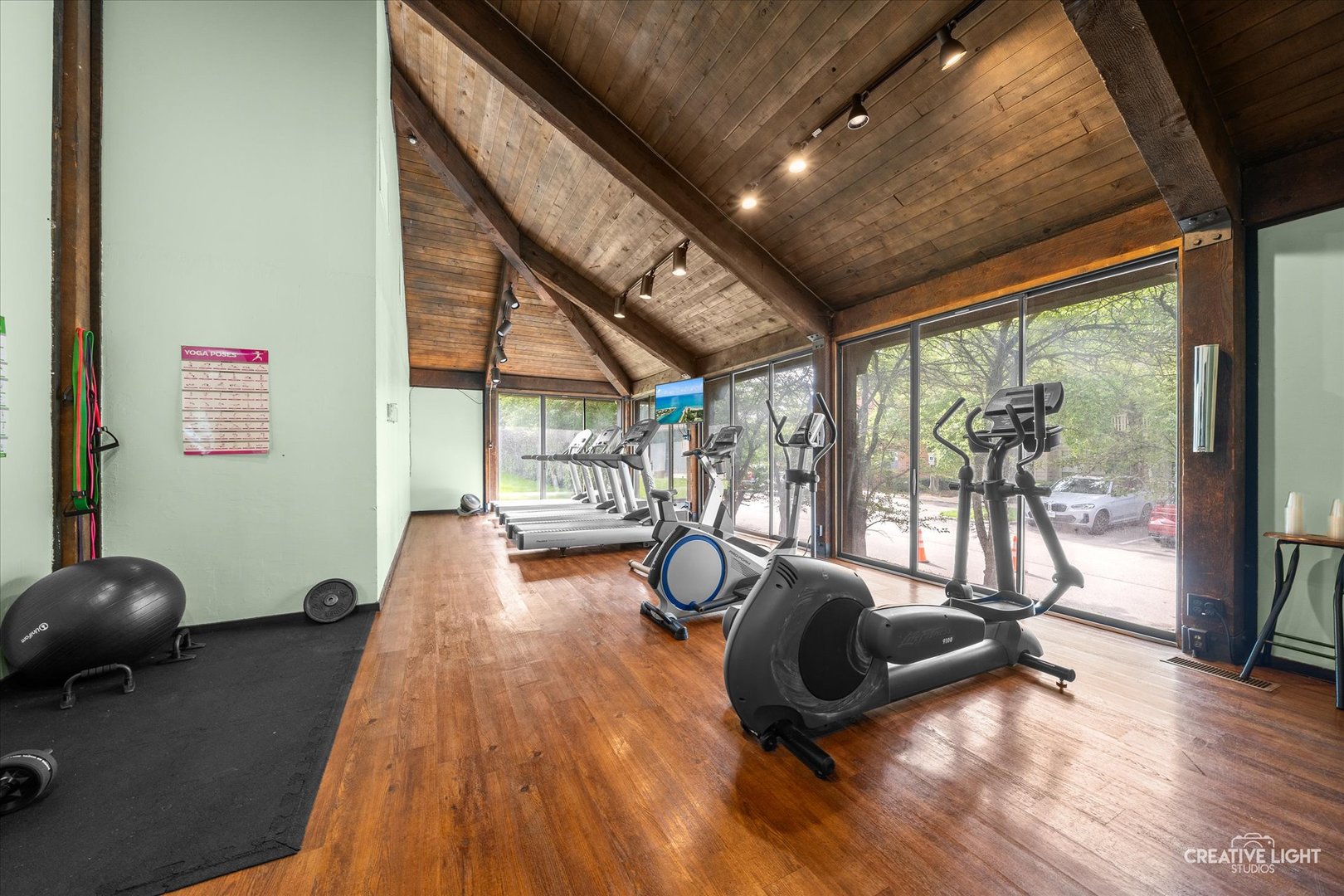 2005 South Finley Road, Unit 1209 Lombard, IL 60148 - Photo 21 of 29 a living room with furniture floor to ceiling window and wooden floor