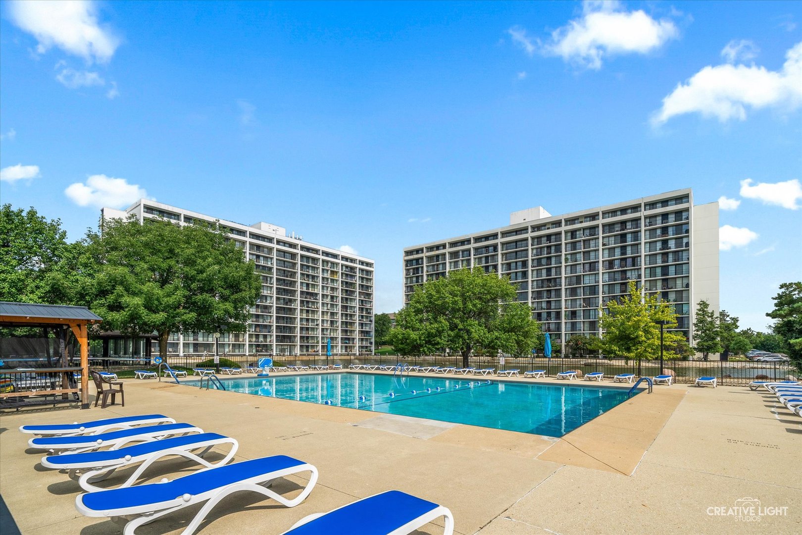 2005 South Finley Road, Unit 1209 Lombard, IL 60148 - Photo 24 of 29 a swimming pool with outdoor seating and yard