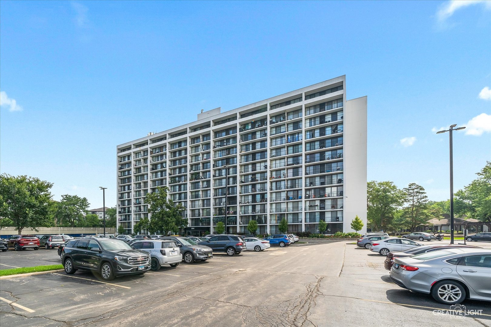 2005 South Finley Road, Unit 1209 Lombard, IL 60148 - Photo 28 of 29 a cars parked in front of a building
