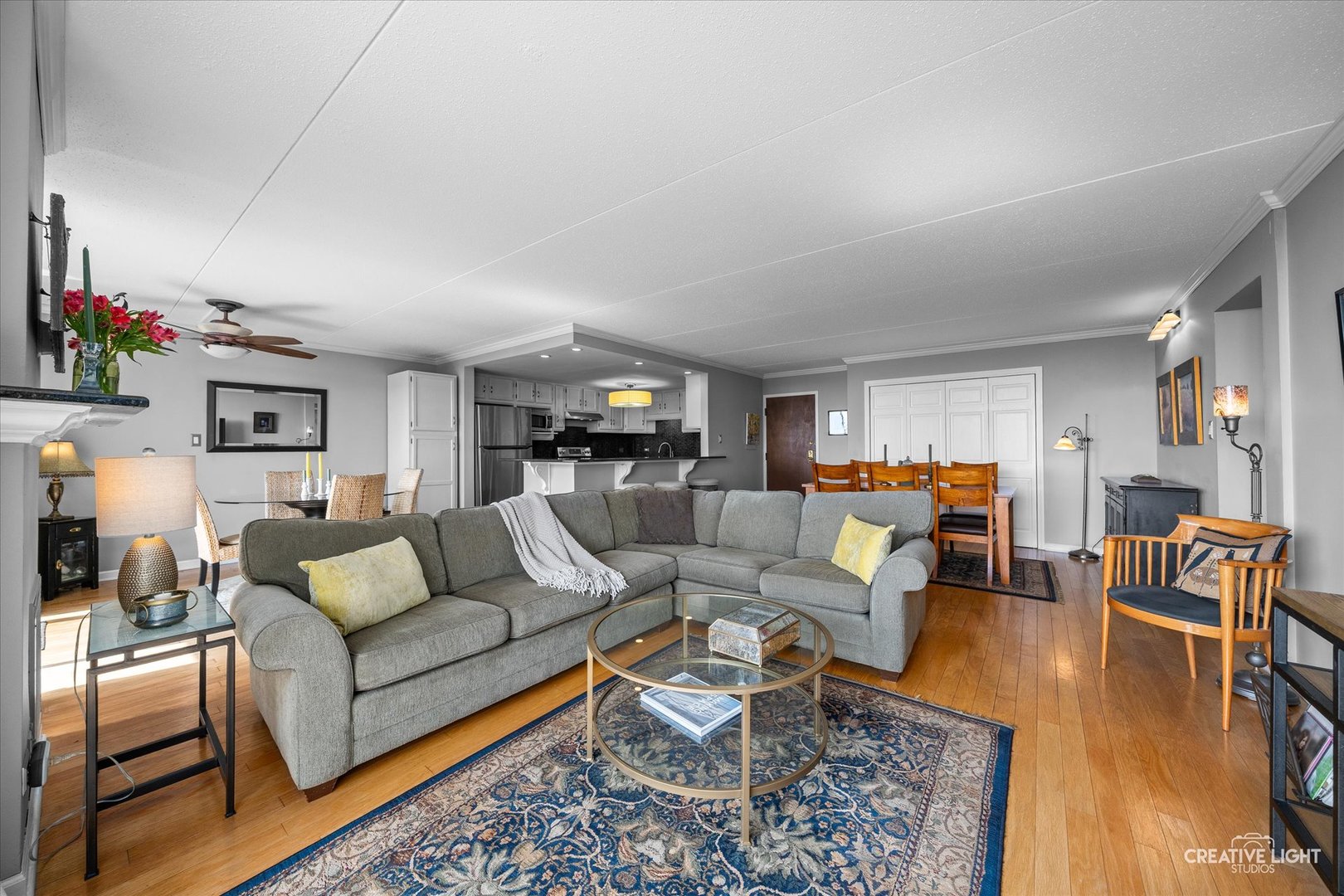 2005 South Finley Road, Unit 1209 Lombard, IL 60148 - Photo 4 of 29 a living room with furniture and a wooden floor