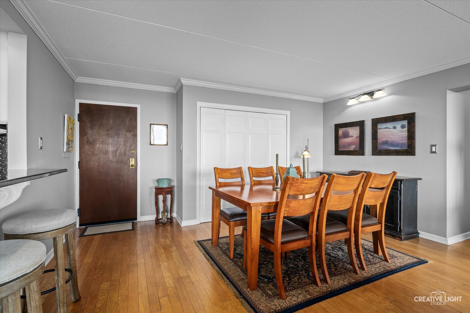 2005 South Finley Road, Unit 1209 Lombard, IL 60148 - Photo 5 of 29 a dining room with furniture and wooden floor
