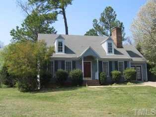 8301 Bellingham Circle Raleigh, NC 27615 - Photo 1 of 11 a front view of a house with a garden