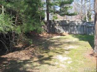 8301 Bellingham Circle Raleigh, NC 27615 - Photo 11 of 11 a view of a yard with plants and trees