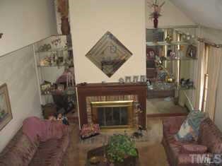 8301 Bellingham Circle Raleigh, NC 27615 - Photo 2 of 11 a living room with furniture and a fireplace
