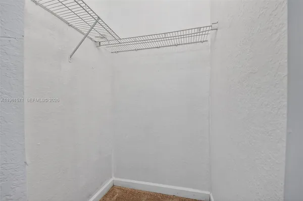 a bathroom with a sink vanity and toilet