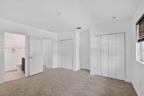a view of a a dining room with furniture window and wooden floor
