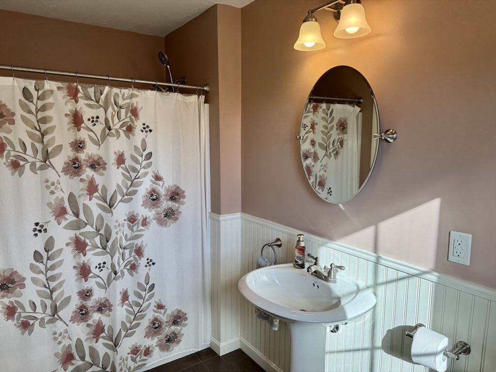 2 Riley Road, Unit B Lunenburg, MA 01462 - Photo 13 of 25 a bathroom with a sink and a mirror