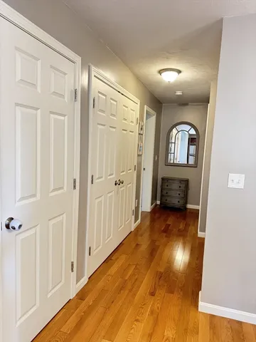 a view of livingroom with hardwood floor and hallway