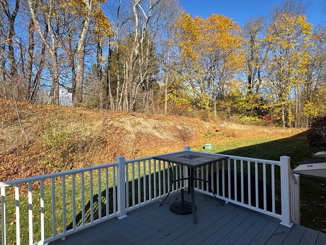 a view of a roof with wooden fence and floor