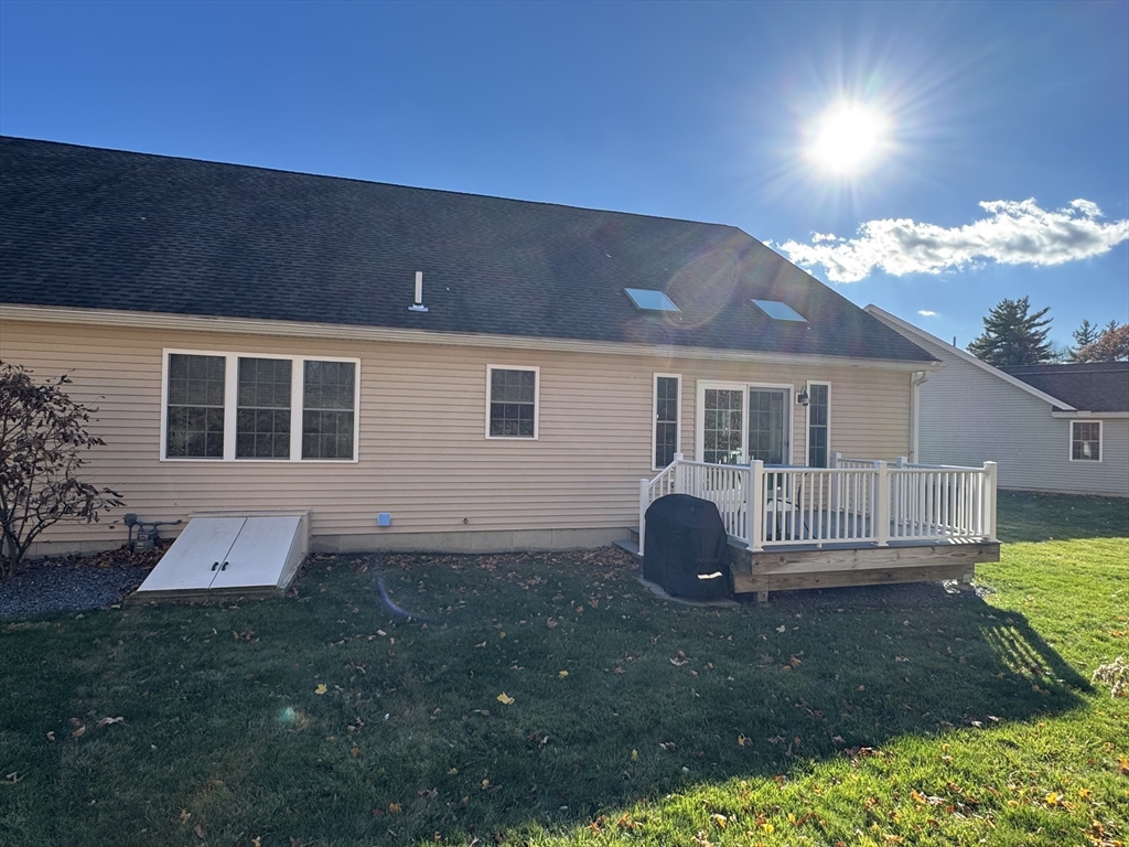 2 Riley Road, Unit B Lunenburg, MA 01462 - Photo 24 of 25 a backyard of a house with table and chairs