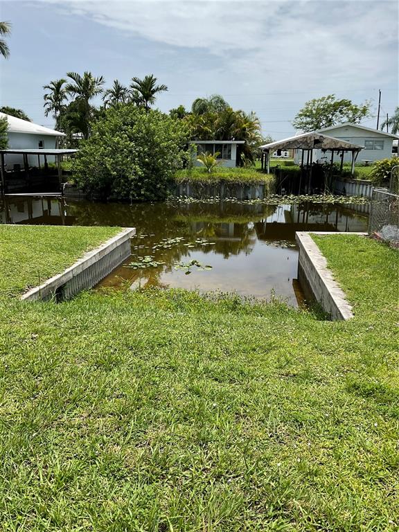 1558 Chobee Street Okeechobee, FL 34974 - Photo 11 of 63 a view of a house with a yard