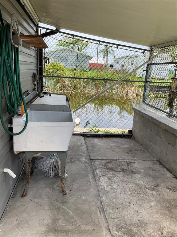 1558 Chobee Street Okeechobee, FL 34974 - Photo 13 of 63 a view of a porch with furniture