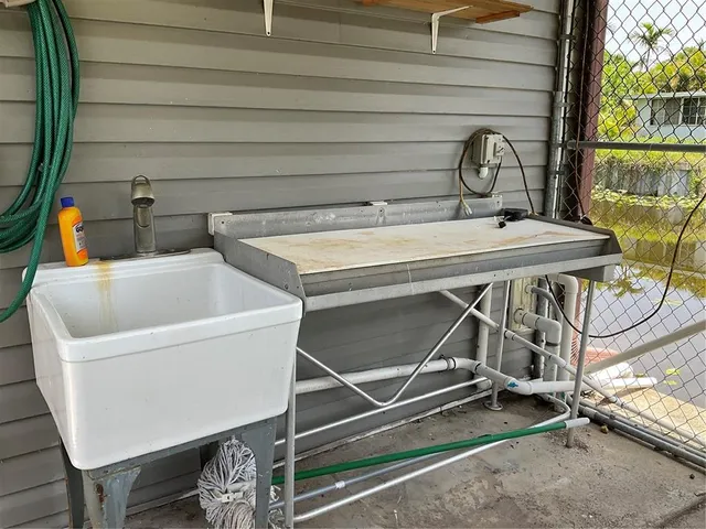 a living room with furniture a couch and a chandelier