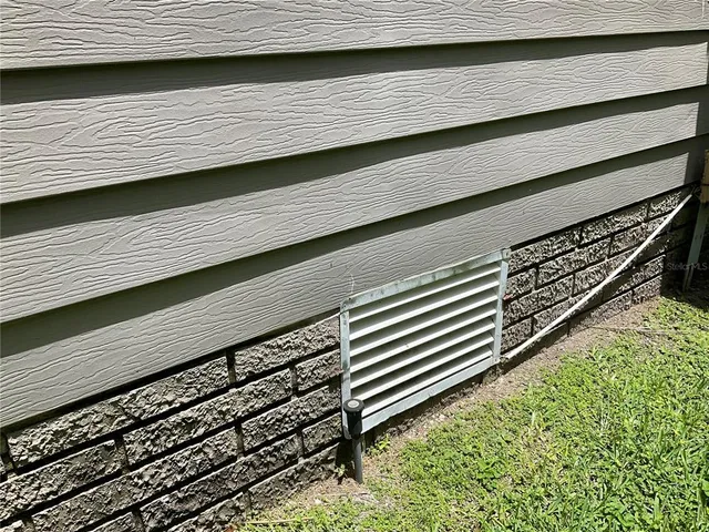 a view of a swimming pool with a patio and a yard