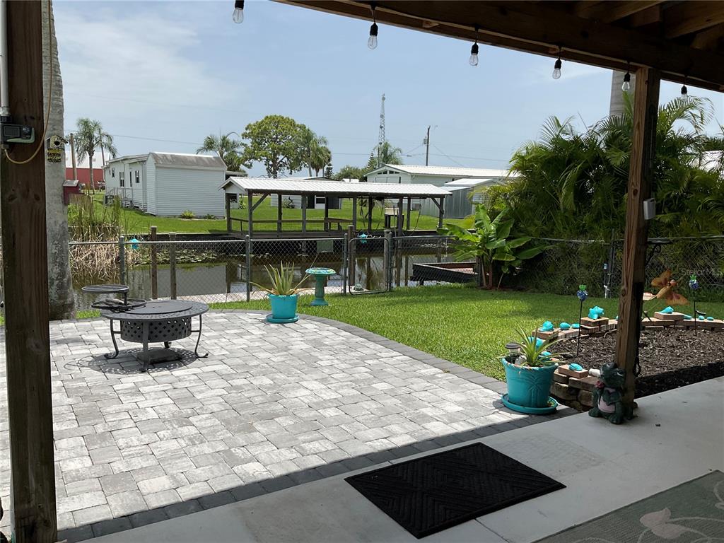 1558 Chobee Street Okeechobee, FL 34974 - Photo 21 of 63 a view of a swimming pool with a patio and a yard