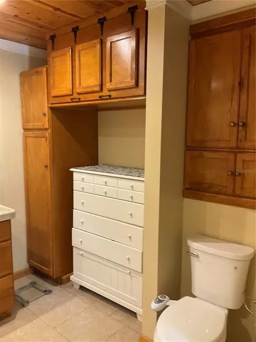 a bathroom with a tub and a window