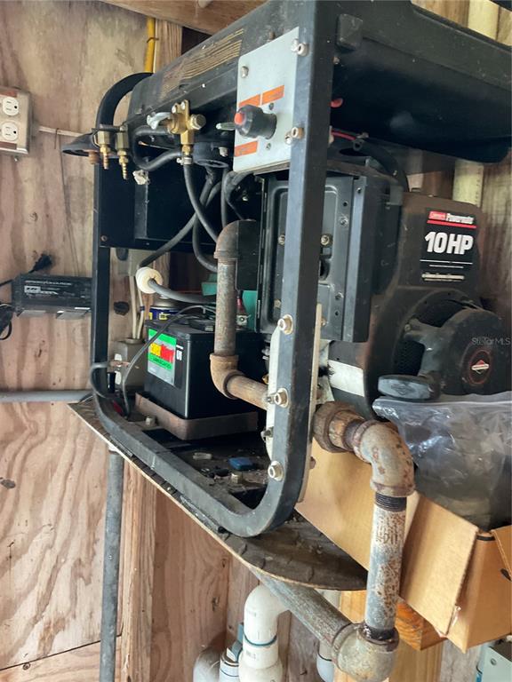 1558 Chobee Street Okeechobee, FL 34974 - Photo 30 of 63 a living room with furniture and a flat screen tv