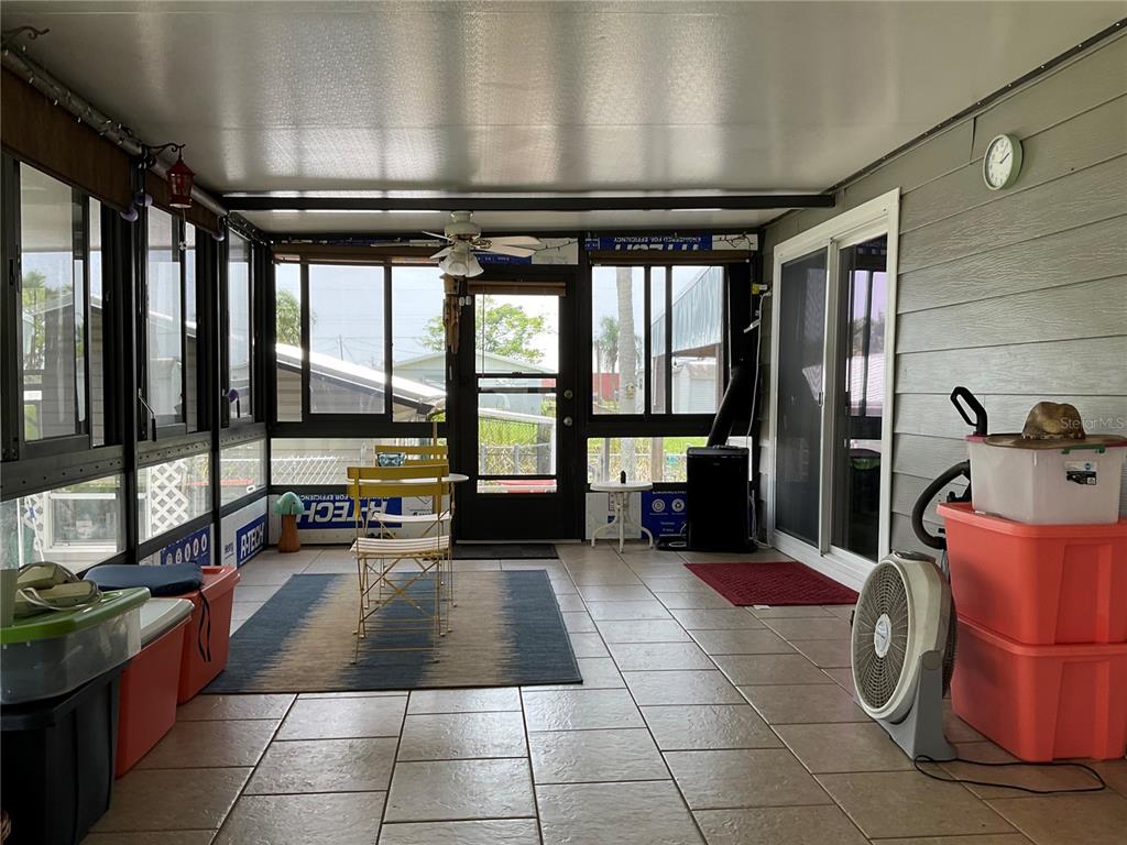 1558 Chobee Street Okeechobee, FL 34974 - Photo 31 of 63 a view of a lobby with furniture and floor to ceiling window