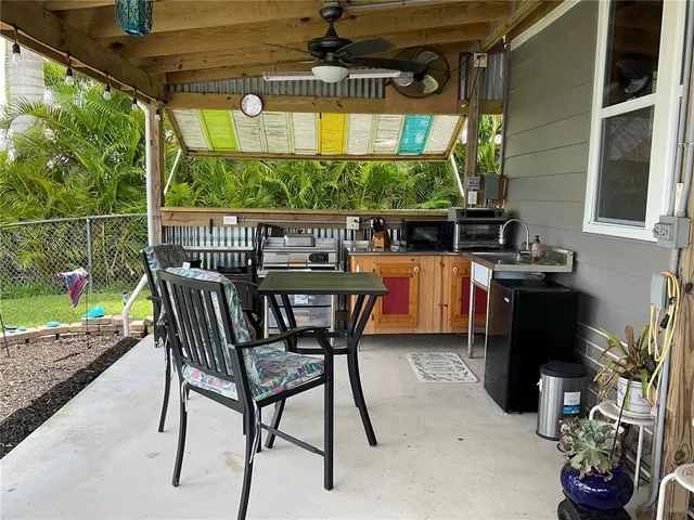 a view of a chairs and table in the patio