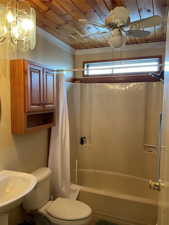 1558 Chobee Street Okeechobee, FL 34974 - Photo 43 of 63 a bathroom with a toilet and a shower