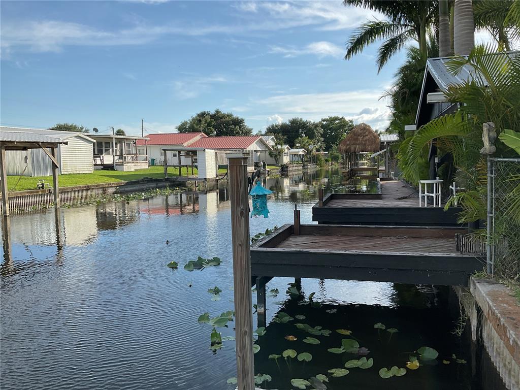 1558 Chobee Street Okeechobee, FL 34974 - Photo 49 of 63 a view of a lake with a terrace