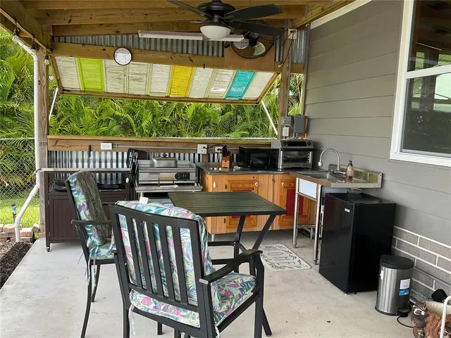 a kitchen with stainless steel appliances granite countertop a refrigerator and a stove