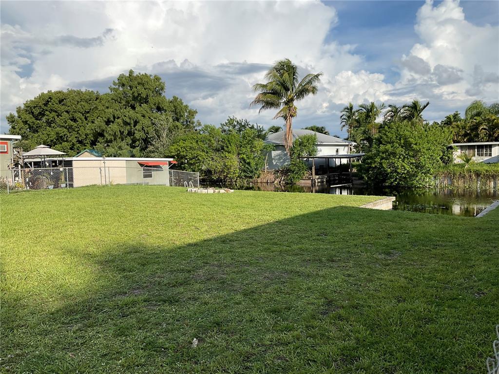 1558 Chobee Street Okeechobee, FL 34974 - Photo 51 of 63 a view of a house with a yard