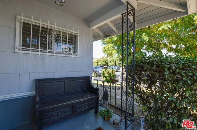 a view of a bench in the backyard