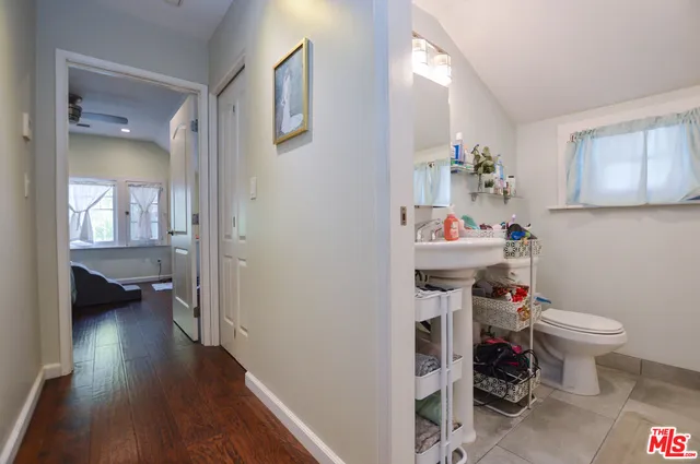 a view of kitchen with stainless steel appliances granite countertop a refrigerator and a sink
