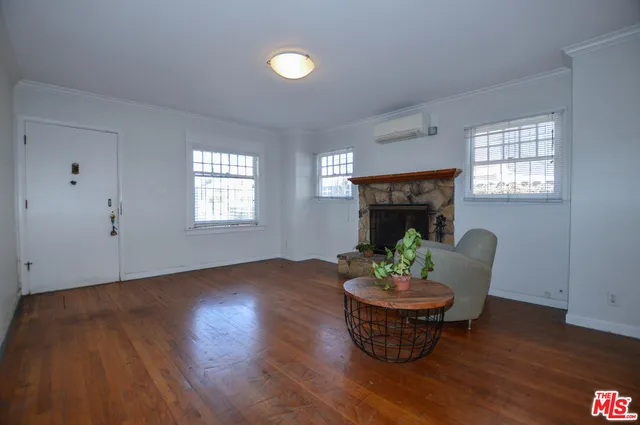 a room with furniture window and wooden floor