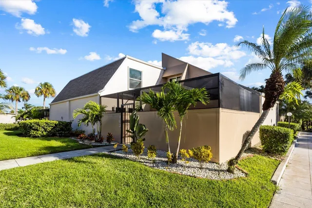 a front view of house with yard and outdoor seating