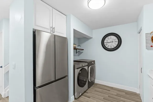 a view of a storage and utility room with washer and dryer