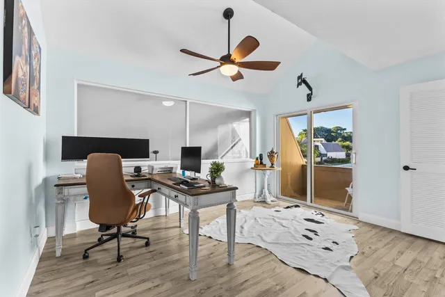 a view of a livingroom with furniture and a window